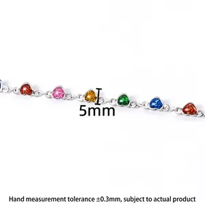 Detail of 5mm colorful enamel heart charms on a silver stainless steel chain for DIY jewelry