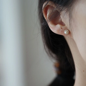 French vintage silver plated pearl stud earrings with sparkling halo worn by model
