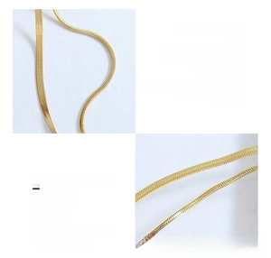 Macro view of double-layer 18K gold plated titanium steel flat and round snake chain