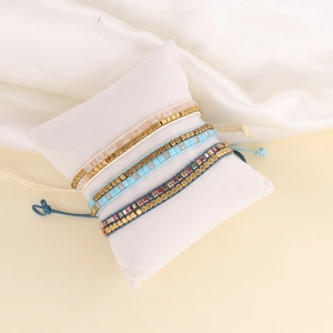 Three-piece bohemian hand-woven beaded bracelets set with crystal glass beads and gold spacers