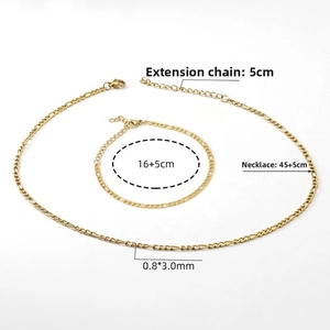 Close-up of golden Figaro chain set with detailed measurements of the necklace and bracelet