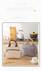 Close-up of insulated lunch bags in cream and purple with Tasty Food text in a kitchen