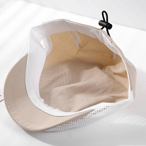 Detailed interior of a mesh sun hat with adjustable drawstring and plastic buckle