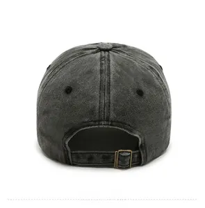 Detail of washed grey baseball cap back showing vintage metal buckle and fabric texture