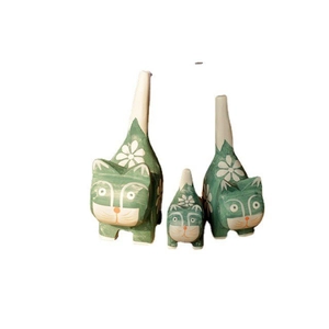 Set of three mint green hand-painted wooden cat figurines with floral patterns
