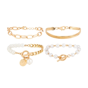 Detail of 4-piece vintage pearl and gold chain bracelet set with rhinestone heart