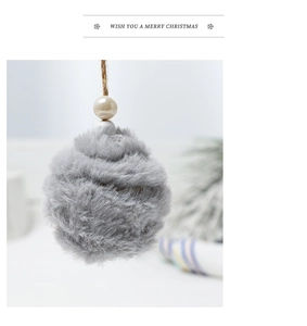 Detail of grey faux fur pompom with white pearl and jute string for holiday decor