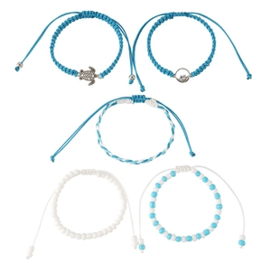 Five-piece set of blue and white beaded bracelets featuring sea turtle and wave charms