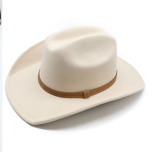 Detailed top view of a cream felt cowboy hat featuring a dark brown leather decorative band