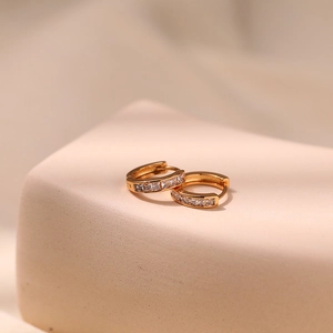 Close-up of 18K gold plated hoop earrings with micro-paved square zircon stones
