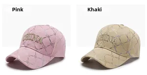 Detail of pink and khaki baseball caps featuring CHINA 3D embroidery and heart patterns