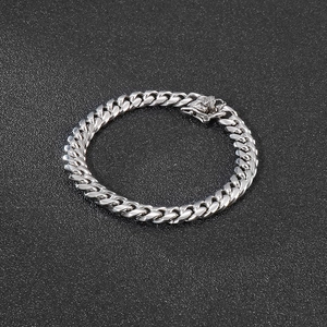 Macro shot of 8mm silver stainless steel Cuban chain bracelet with high-polish finish
