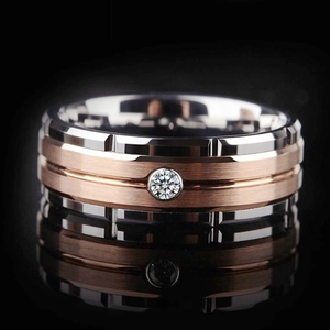 Close-up detail of a two-tone titanium steel men's ring with a central sparkling gemstone