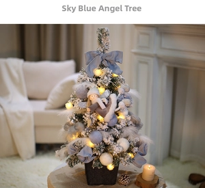 Detail of blue angel mini Christmas tree with LED lights and white feather decorations