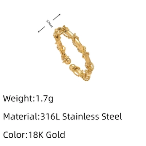 Macro detail of 3.7mm twisted 18K gold stainless steel ring with specs and weight