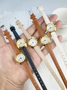Macro shot of vintage small dial women quartz watches with leather straps in five colors