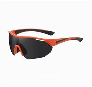 Detail of professional cycling sunglasses with orange and black frame and tinted lenses