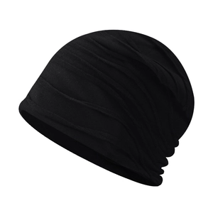 Detail of black knitted beanie with textured horizontal pleats for a slouchy layered look