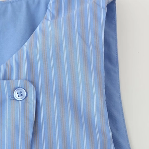 Women's light blue striped vest set featuring vertical patterns and button details