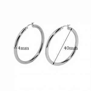 Detailed view showing 40mm diameter and 4mm thickness of hollow gold hoop earrings