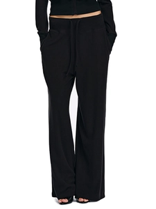 Detail view of black drawstring sweatpants featuring a soft knitted fabric and side pockets