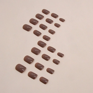 Glossy Morandi purple-brown short square round press-on nails set on beige surface