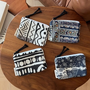 Bohemian style linen coin purses with black and white patterns and tassel zippers