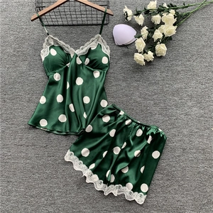 Women's dark green satin sleepwear set with white polka dots and lace trim detailing
