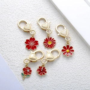 5-piece set of gold heart clasps with vibrant red enamel flower pendants for bags