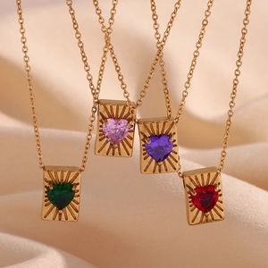 Detail showing square gold card necklaces with heart-shaped gems in multiple colors