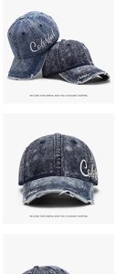 Detail of embroidered Colorful lettering on washed denim baseball cap with frayed edges