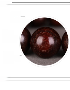 Macro detail of high density red sandalwood beads with natural golden stars and wood grain