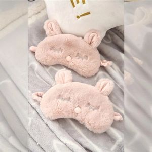 Plush pink bunny sleep mask with cute closed eyes embroidery for travel and home use