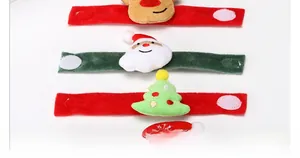Detailed view of Christmas slap bracelets featuring plush Santa, reindeer and tree designs