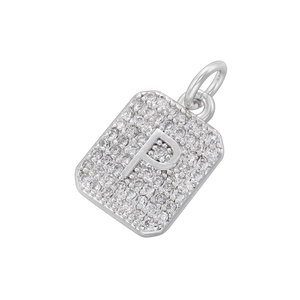 Detailed close-up of a silver rectangular pendant with letter P set in cubic zirconia