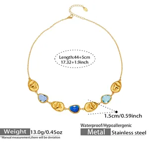 Close-up of geometric faceted glass stones on a gold plated stainless steel necklace