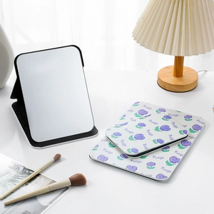Detail view of foldable white and purple tulip makeup mirrors in two different sizes