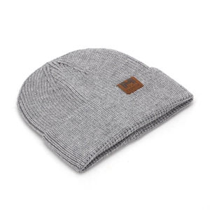 Gray ribbed knit beanie hat with brown leather fashion crown label on white background