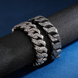 Vintage engraved stainless steel cuban chain bracelet for men on leather display