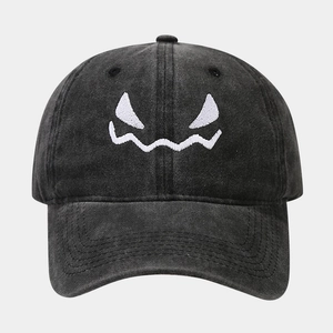 Vintage washed cotton baseball cap with embroidered pumpkin skull face in black