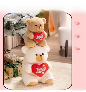 Macro detail of plush teddy bears holding love hearts in a festive gift setting