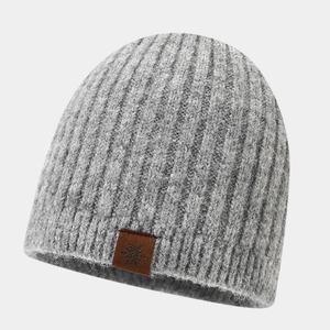 Women's grey chunky knit beanie with leather snowflake patch for winter outdoor warmth