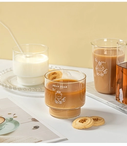 Detail view of cute cartoon glass cups featuring Hello Bear and My Puppy illustrations