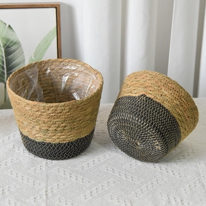 Detail of natural seagrass baskets with waterproof liners and bicolor weave design