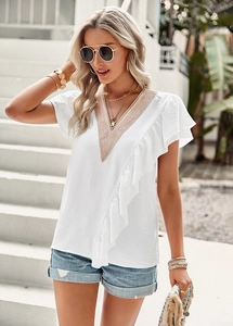 Detail of a white V-neck short-sleeved blouse featuring lace stitching and ruffle trim