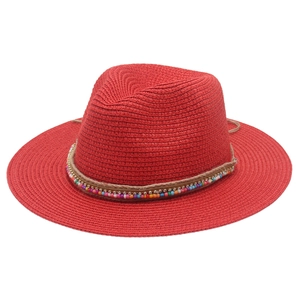 Close-up of red Panama straw hat featuring colorful bead accents and a rustic hemp rope band