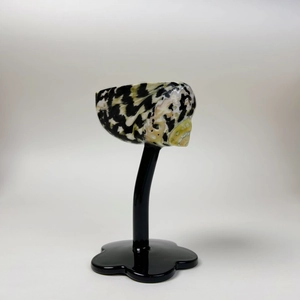 Polished natural seashell decor on a sleek black acrylic base for home or gift