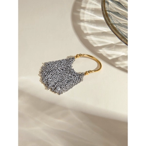 Luxurious 18k gold and silver two-tone stainless steel chain fringe ring on cream background