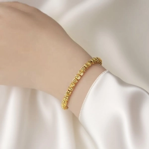 Elegant 18k gold plated beaded bracelet with textured watermelon beads on silk