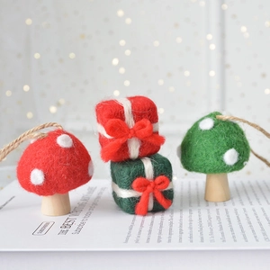 Handmade wool felt mushroom and gift box ornaments for Christmas tree decor